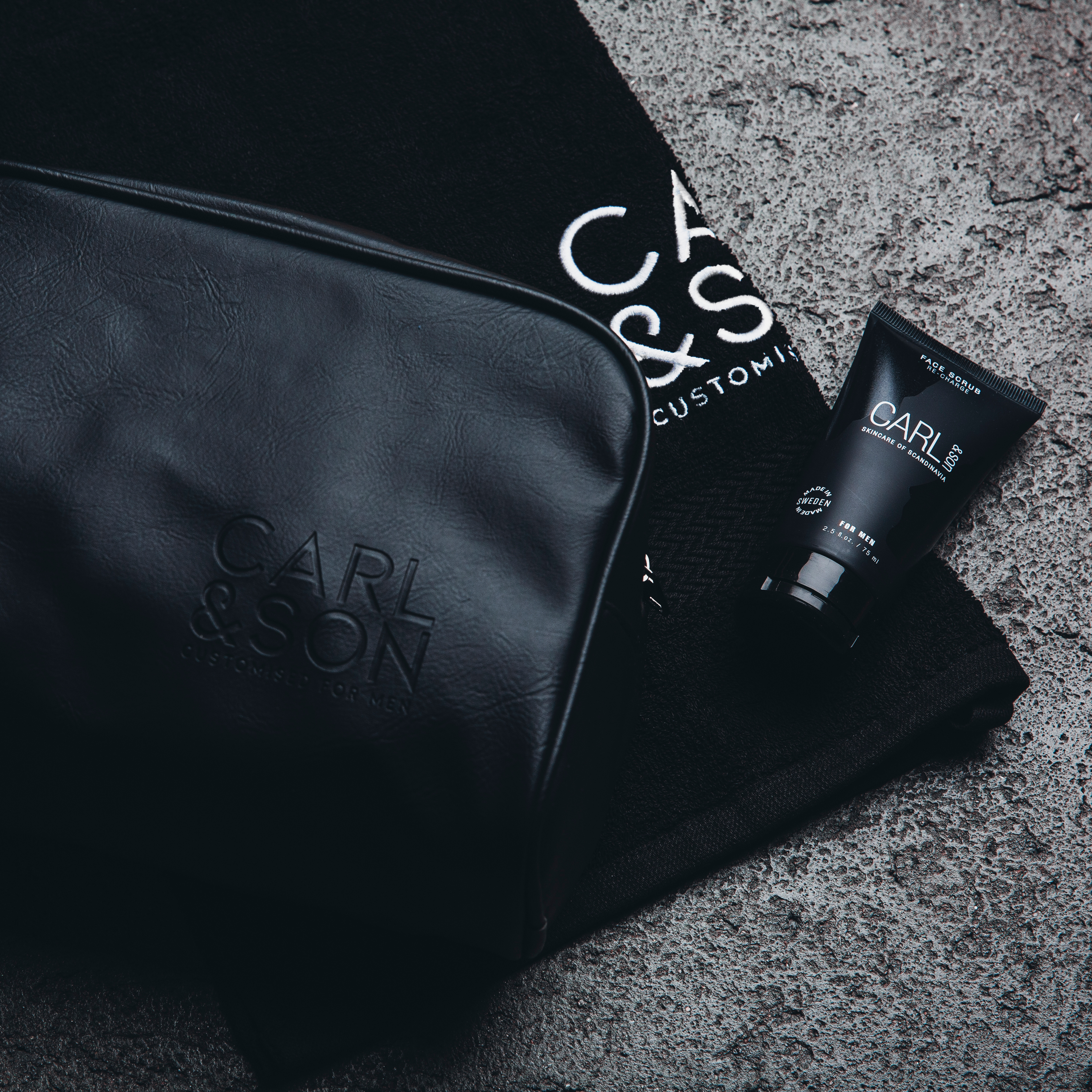 toilet bag besides towel and facescrub