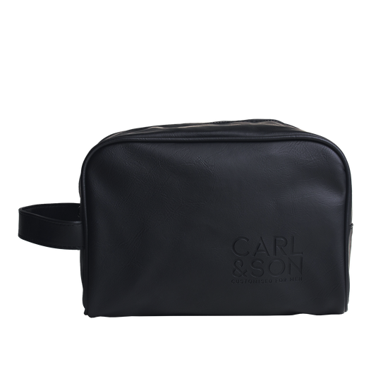 toilet bag with the handle on the left and carl and son logo on the right corner