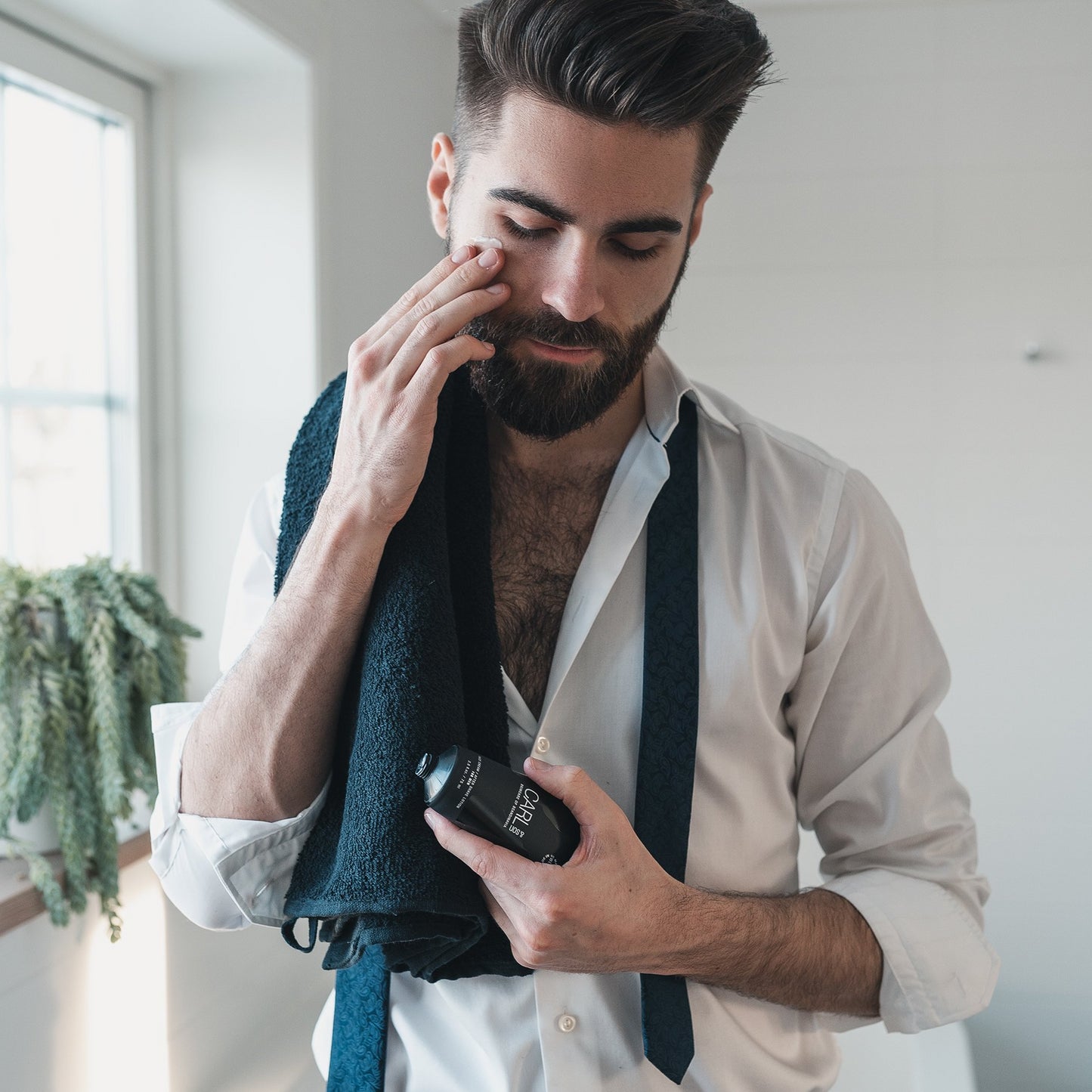 man applying the face cream light